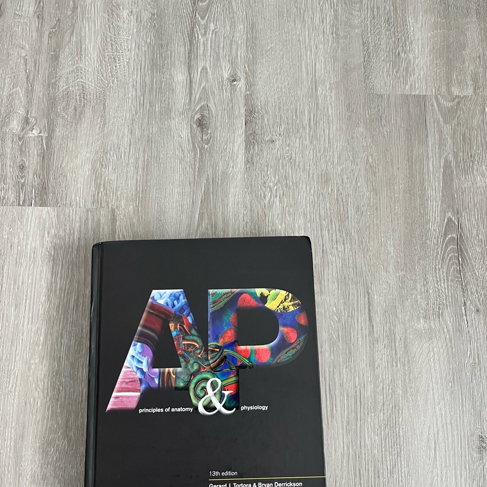 Black Hardcover Book on Anatomy and Physiology
